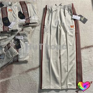 Pantalones de hombre 2022 rayas marrones agujas pantalones hombres mujeres naranja mariposa 1 1 agujas pantalones de chándal High Street AWGE pantalones rectos T221205