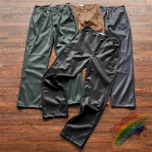 Pantalones para hombres Pantalones de chándal de cuero bordado para hombres Mujeres de alta calidad Casual Jogger Empalme Pantalones de PU con etiqueta T231214