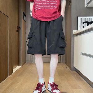 Shorts masculins 2024 Fashion d'été lâche décontracté large-leg masculin couleur cargo dames poches de la longueur du genou pantalon court k140
