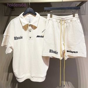 Pantalones cortos para hombres 22ss Sumer Rhude x Mclaren Carta bordada Solapa Jersey Camiseta 1 1 y manga corta para mujer S-XL Traje para hombres