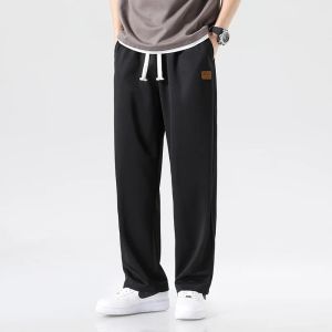 Pantalones deportivos holgados para correr de diseñador para hombre, 100% poliéster, pierna recta, basculador ancho, sudadera informal