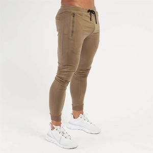 Mens Pants Pantalons décontractés uni hommes pantalons de jogging maigres pantalons de survêtement automne gymnase Fitness vêtements de sport en coton pantalons bas mâle course survêtement 231007