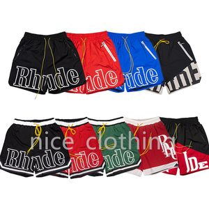 Pantalones cortos Rhude para hombre Pantalones cortos de diseñador Pantalones deportivos para mujer Pantalones cortos de playa de verano Gimnasio Pantalones cortos de fitness Pantalones sueltos de estilo extragrande