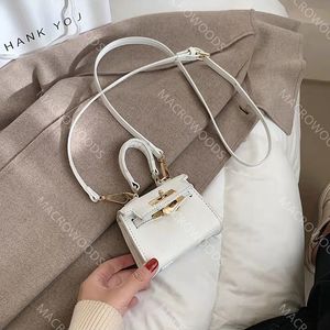 Mini bolso de mano Bolso de mensajero de diseñador Bolsos para niñas Monedero para niños Bolsos de hombro de mujer de moda Cuerpo cruzado de dama de lujo Estuches para auriculares cosméticos Cartera simple HBP