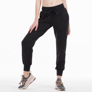 Naked Feel Tela Yoga Entrenamiento Deporte Joggers Pantalones Mujer Cintura Cordón Fitness Correr Pantalones deportivos con dos bolsillos laterales Estilo