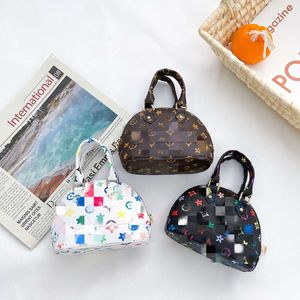 Nouvelle version coréenne pour enfants Shell Baby Zero Portefeuille Princesse Accessoires de rue pour femmes Sac à bandoulière préscolaire 2024 78% de réduction sur le magasin en gros