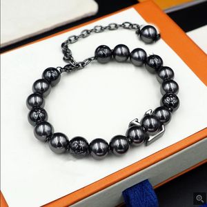 Nuevo diseño de joyería de acero de titanio con letras en V, collar de cadena de cuentas negras, pendiente de moda, pulsera, joyería de diseñador LV019601