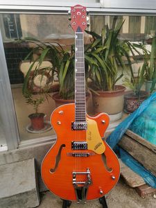 Guitarra eléctrica con tapa de arce flameado suizo naranja-rojo OEM, cuerpo de guitarra semihueco, puente de vibrato grande, en stock,