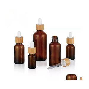 Bouteilles d'emballage Flacon compte-gouttes en verre dépoli Huile essentielle avec des yeux et des couvercles en bambou par échantillon Flacons Essence Liquide Cosmétique Goutte De Dhv2I