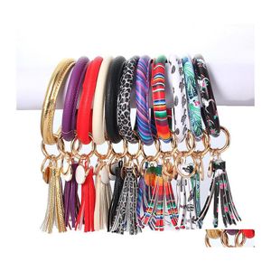 Favor de fiesta PU Llavero de cuero Girasol Pulsera de impresión Llavero Leopardo Borla Brazalete Moda Círculo Correa de muñeca Colgante Regalo YFA23 DH0G1