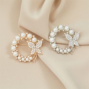 Broche de mariposa circular con diamantes de imitación para mujer