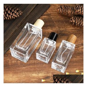 Bouteilles de parfum en gros vaporisateur en verre de forme carrée par bouteilles 30 ml 50 ml 100 ml vide bouteille rechargeable bureau de livraison directe Dhgarden Dh5Ay