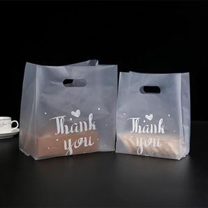 Sacs de stockage 50 pc / lot sac en plastique transparent avec poignée pour magasin de magasin alimentaire à emporter emballage d'affaires paquet entier merci yo206l