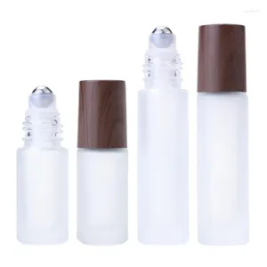 Botellas de almacenamiento 30 piezas PCS White Frost Glass Cream Roll on Massage Muestra de botella Rodillo de acero Falso Tapa de madera VIALES ESENCIALES DE Aceite 5 ml