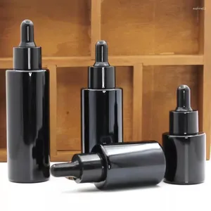 Botellas de almacenamiento Aceite esencial de vidrio negro 20/30/40/060 ml Esencia de botella de cosméticos con cabello de goma anillo