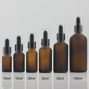 Botellas de almacenamiento Proveedores China de 100 ml de botella de belleza de vidrio ámbar esencial con cuentagotas negras