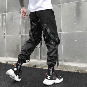 Pantalones de carga de streetwear hombres harajuku pantalones tácticos cinta multi-bolsillo pantalones mujeres cintura elástica hiphop masculino pantalón negro x0723