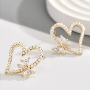 Pendientes de tuerca YYSUNNY clásico en forma de corazón para mujer con incrustaciones de perlas de circón pajarita de lujo joyería de moda regalo de cumpleaños