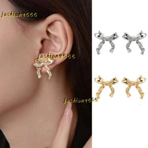 Boucles d'oreilles à tige 2024 paire de femmes Oorbellen doré en forme de nœud papillon Orecchini mignon Piercing arc accessoires boucles d'oreilles de créateur bijoux cadeau de haute qualité