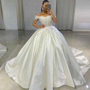 Superbe perle hors de l'épaule robe de mariée robes de mariée paillettes satin princesse robe de mariée plissée grande taille arabe Dubaï robes de mariée pour la mariée YD