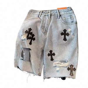 Pantalones cortos de mezclilla con borde irregular y agujero cruzado para hombre de verano Diseño Sensación informal Capris Mié Pantalones anchos de pierna media Hombres Jeans Shorts A3rT #