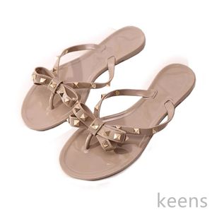 Zapatos de playa de verano para mujer, zapatos planos clásicos con tachuelas y lazo fresco, sandalias de gelatina remachadas para mujer