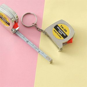 Capeélago de llaves de cinta de cinta Mini Keychains de cinta de medición retráctil con herramienta de utilidad de bloqueo de diapositivas para la vida diaria MHY074