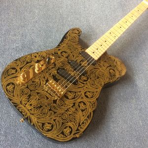 La guitare gauche or Gold Paisley Mahogany Body Electric Guitar