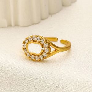Anillos de diseñador de letras chapados en oro de 18 quilates de alta calidad para hombre y mujer, joyería de anillo de diamante de metal de cristal de moda, apertura de un tamaño retro zl070