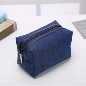 Bolsa de cosméticos portátil de viaje Bolsas de cosméticos Cremallera de tela Hardware sólido Maquillaje Hanbag Tote de almacenamiento de artículos de tocador Llevar Paquete de viaje de gran capacidad Artículos diversos Bolso azul