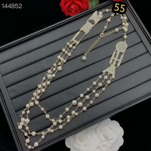 Cuentas blancas Collares pendientes Colgantes Joyería Otoño e invierno Arco Flecha Letra Perla Suéter largo Cadena Moda Temperamento Versátil Entrega de gota con caja