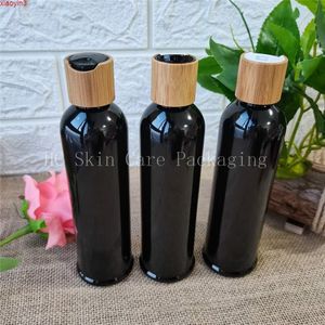 Venta al por mayor de botellas de loción y champú de plástico negro transparente de 8OZ, tapa de disco con tapa de bambú, dispensador de botellas vacías para productos de champú