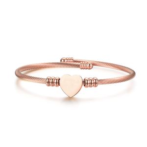 Venta al por mayor de brazaletes en forma de corazón de diseñador, trenza de alambre de acero, pulsera de melocotón de acero de titanio, joyería de amor