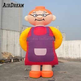 wholesale Gonflable géant personnalisé des Pays-Bas de haute qualité Sarah grand-mère vieille femme porte un personnage de dessin animé de tablier pour la publicité