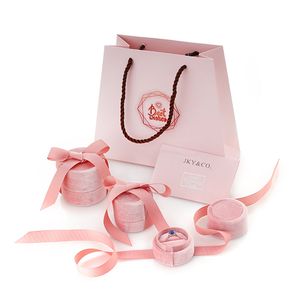 Venta al por mayor de cajas de joyería de anillo de regalo de terciopelo blanco rosa con cinta