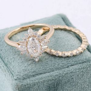 Precio al por mayor de joyería de oro Real sólido de 14K 1.5Ct/2Ct/3Ct personalizado D VVS Oval Moissanite Conjunto de Anillo de compromiso de diamante para mujeres