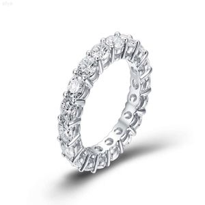 Precio al por mayor por anillo de eternidad de boda con diamantes de moissanita en forma redonda de oro auténtico blanco de 18k para mujer