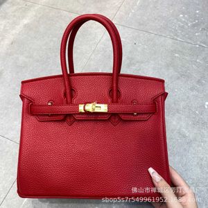 Venta al por mayor Top Original Bojin bolsos de mano tienda en línea Listado Bufanda de seda patrón de lichi bolso de cuero de vaca para mujer Mensajero de mano con logotipo real