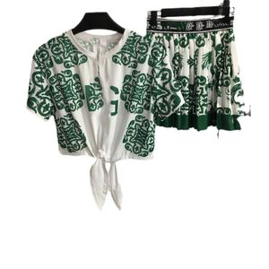 Falda de traje de mujer Traje de diseñador de ropa de mujer de lujo top de manga corta falda delgada corta de dos piezas Plisado de algodón con estampado floral conjunto de verano TAMAÑO S-L