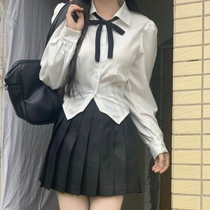 Robes de travail Japon Coréen À Manches Longues JK Uniforme Scolaire Blanc Arc Blouse Costume Taille Haute Plaid Jupes Plissées Ensemble Femmes Étudiants Fille