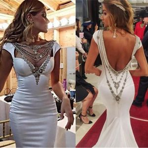 2020 Vestidos de noche de sirena glamorosos Escote de cristal elegante Mangas casquillo Satén Marfil Sin espalda Vestidos de noche formales Vestidos de celebridades