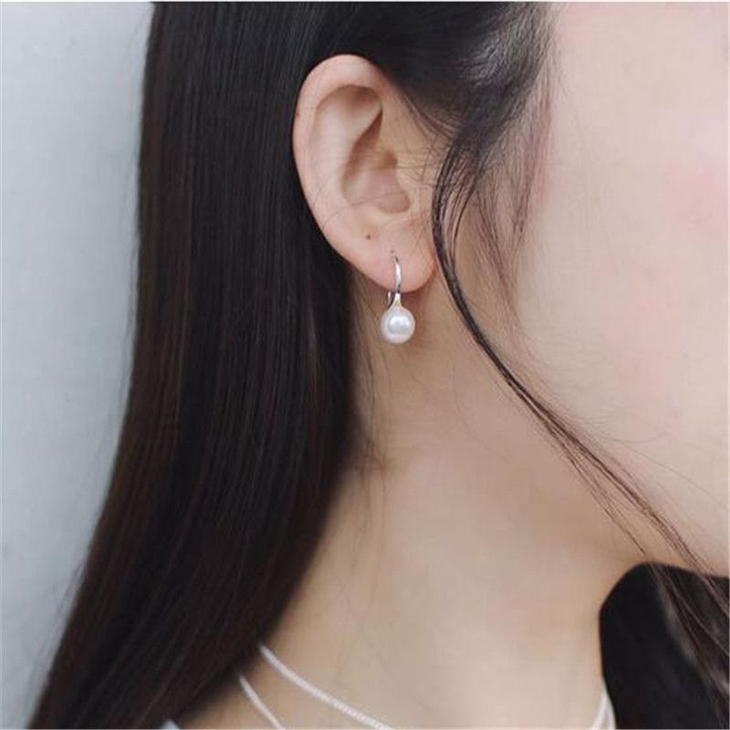 white pearl earrings