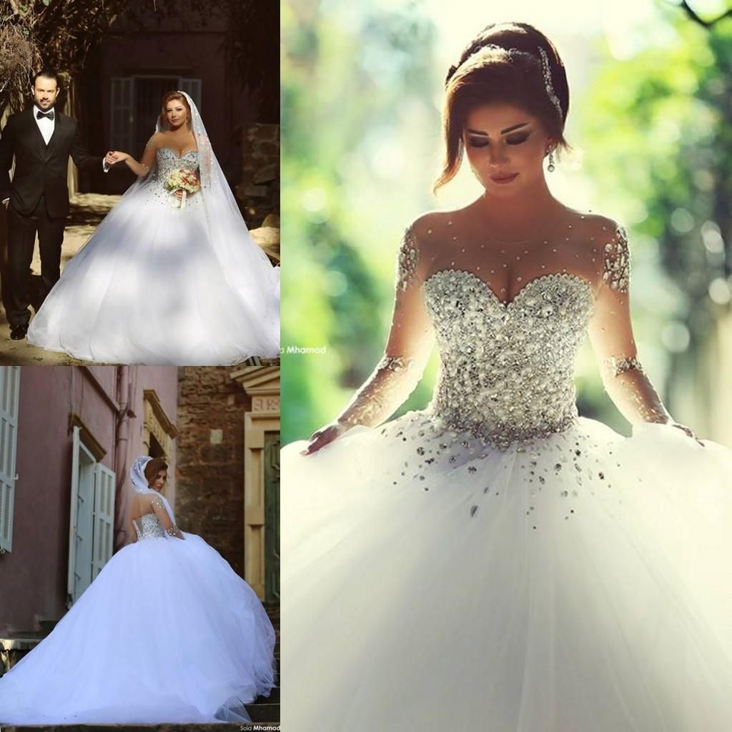 Våren 2021 lyxkristall bröllopsklänningar brudklänningar med kristall pärlor en linje ren illusion crew neck långärmad golv längd arabiska
