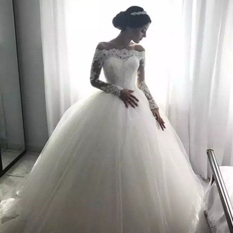 long sleeve lace wedding dress with tulle skirt