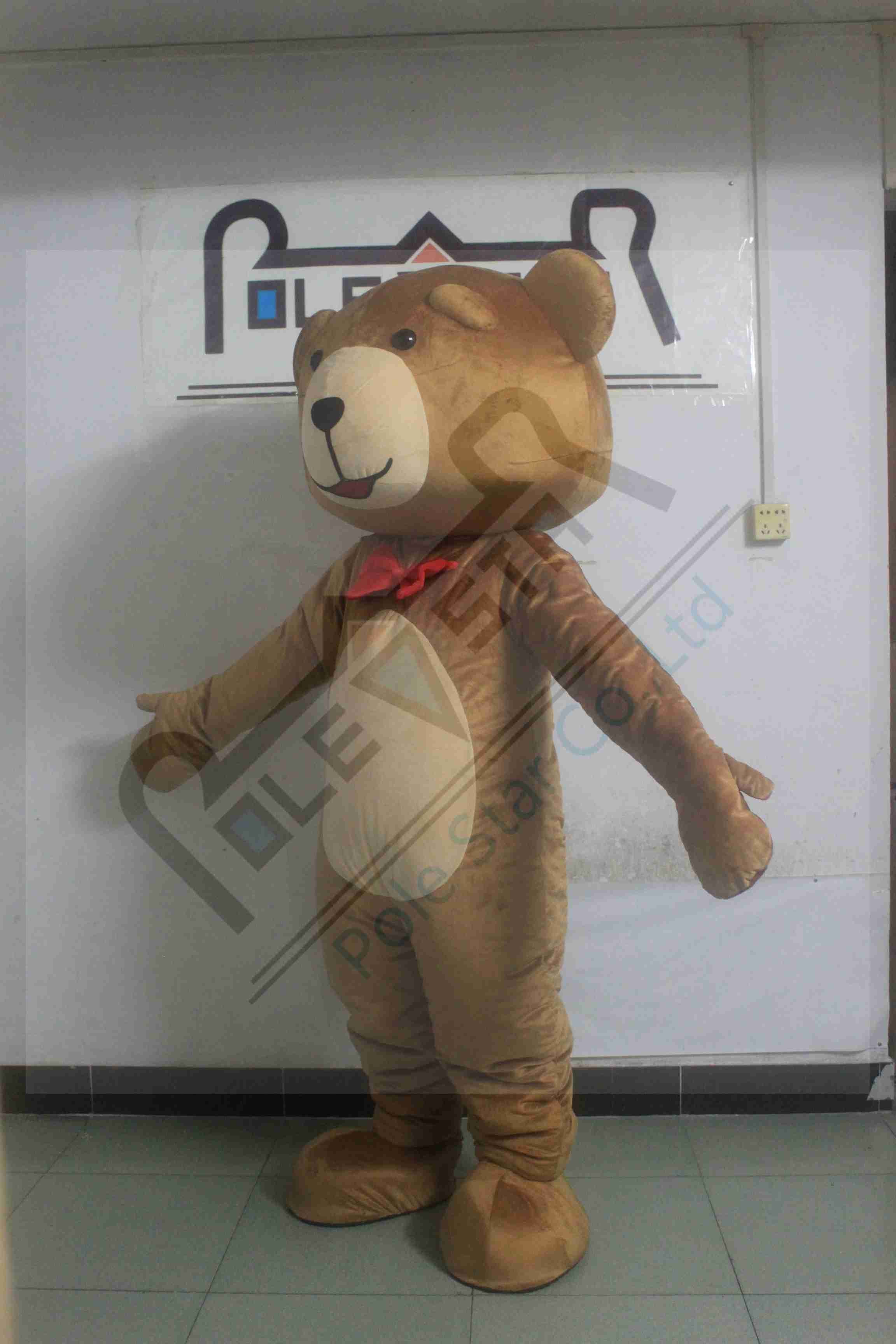 brown teddy bear with red bow