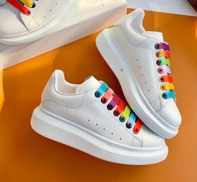 white sneakers with rainbow bottoms