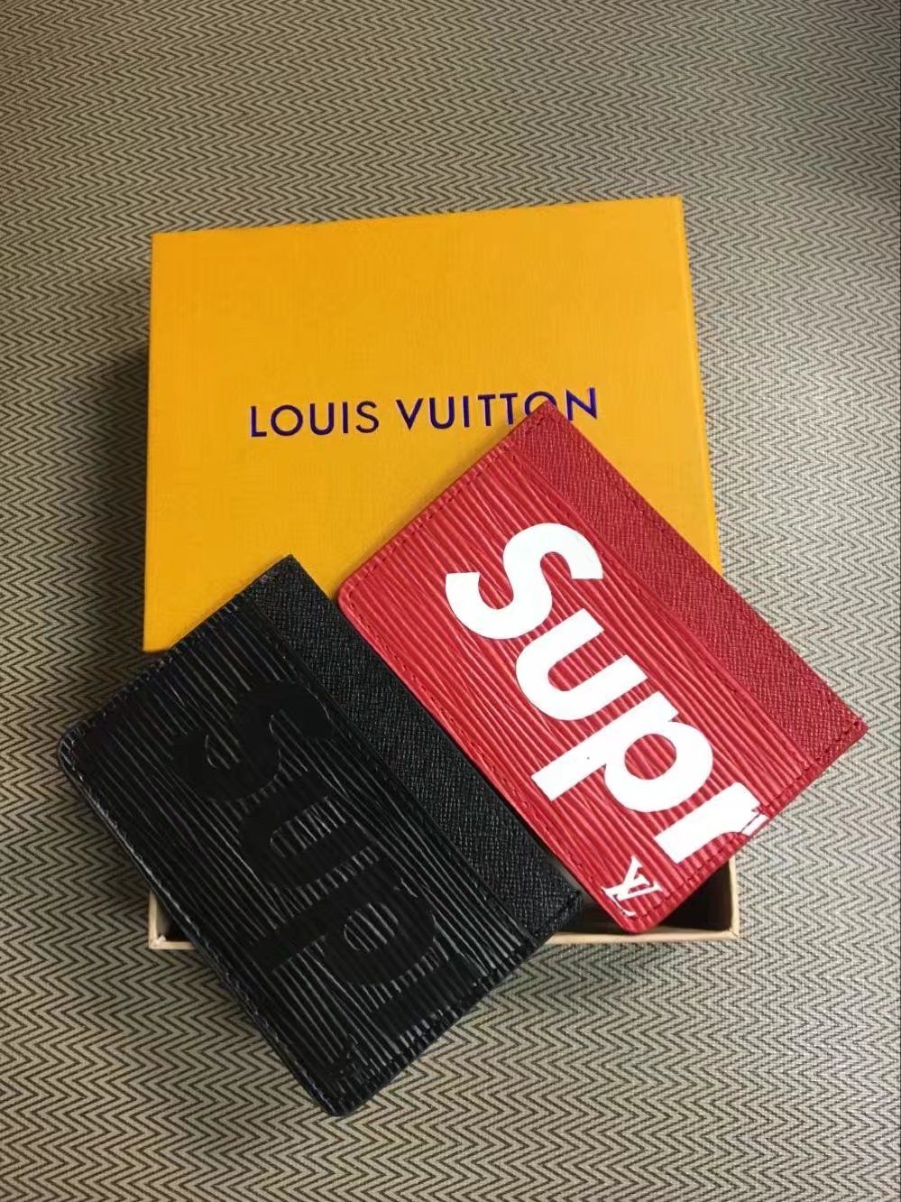 lv supreme clutch bag