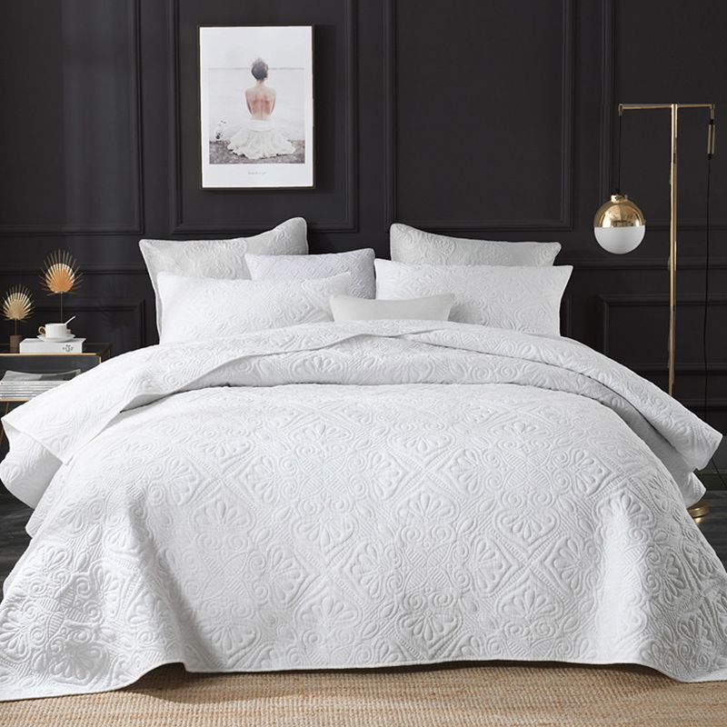 white cotton quilted bedspread