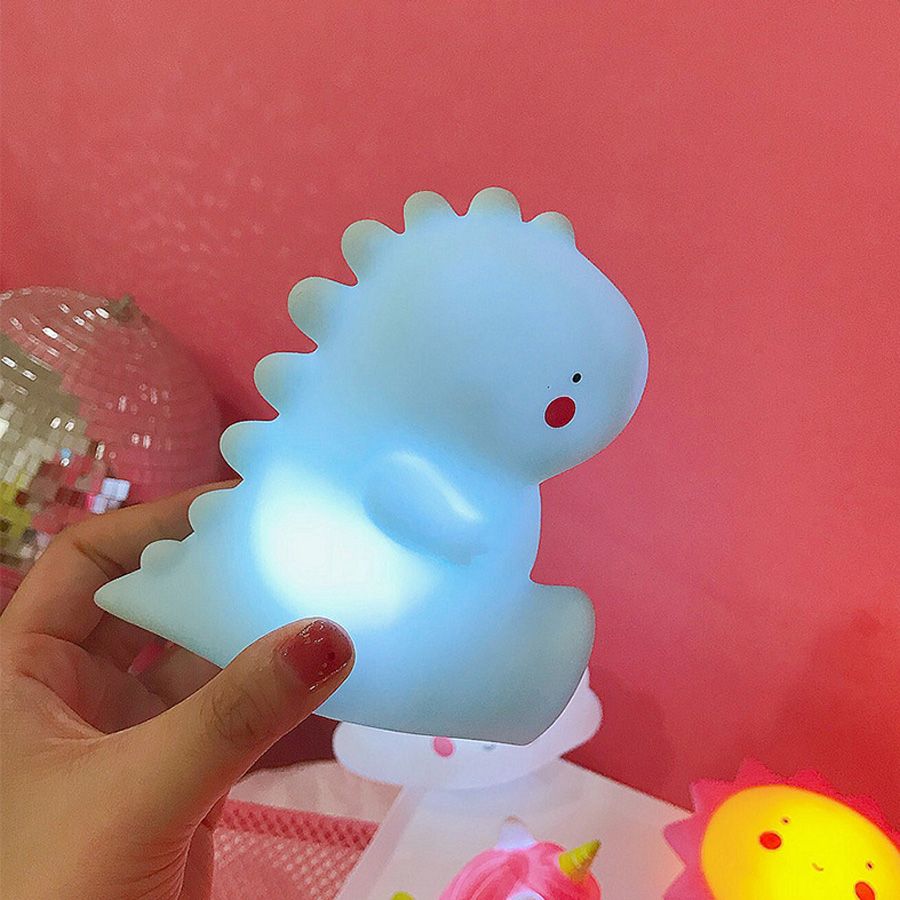 dinosaurio con luces