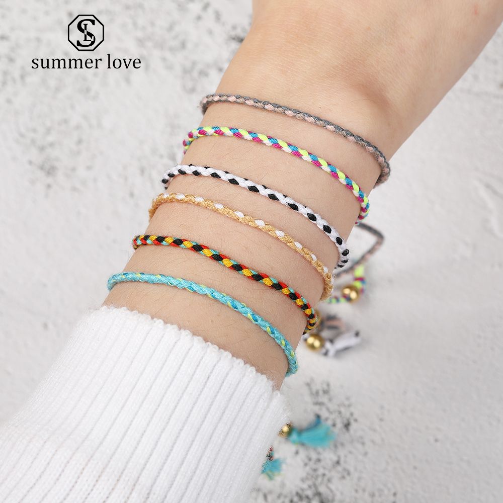 Desinger la pulsera colorida de la cuerda tejida hecha a para las mujeres de los